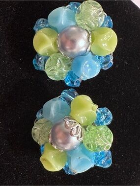 E38- Vtge. Germany clip-on earrings feature a cluster design.